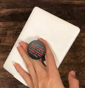 Bookish essentials Kindle paperwhite with popsocket